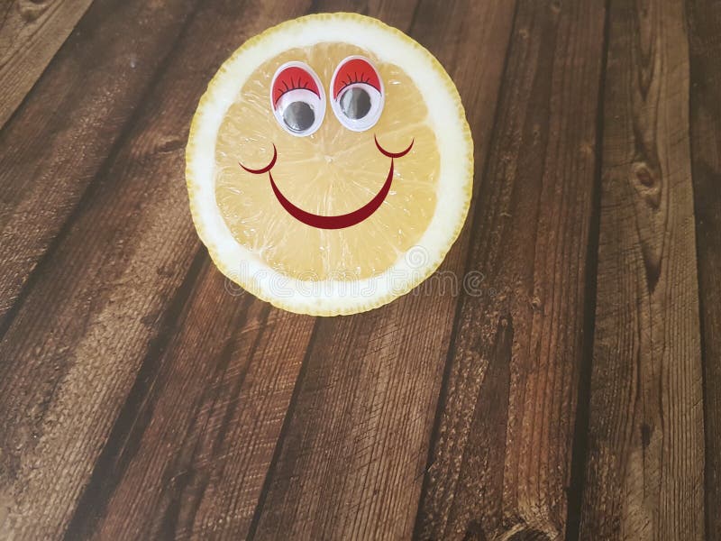 Lemon cartoon eyes on wooden children menu. Lemon cartoon eyes on wooden children menu