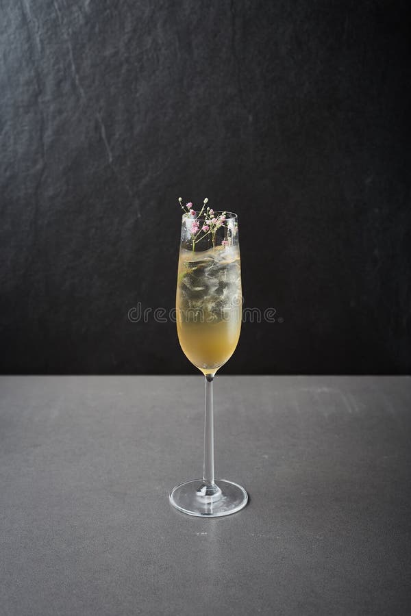 Lemon Champagne Cocktail on Dark Stone Table. Stock Photo Image of
