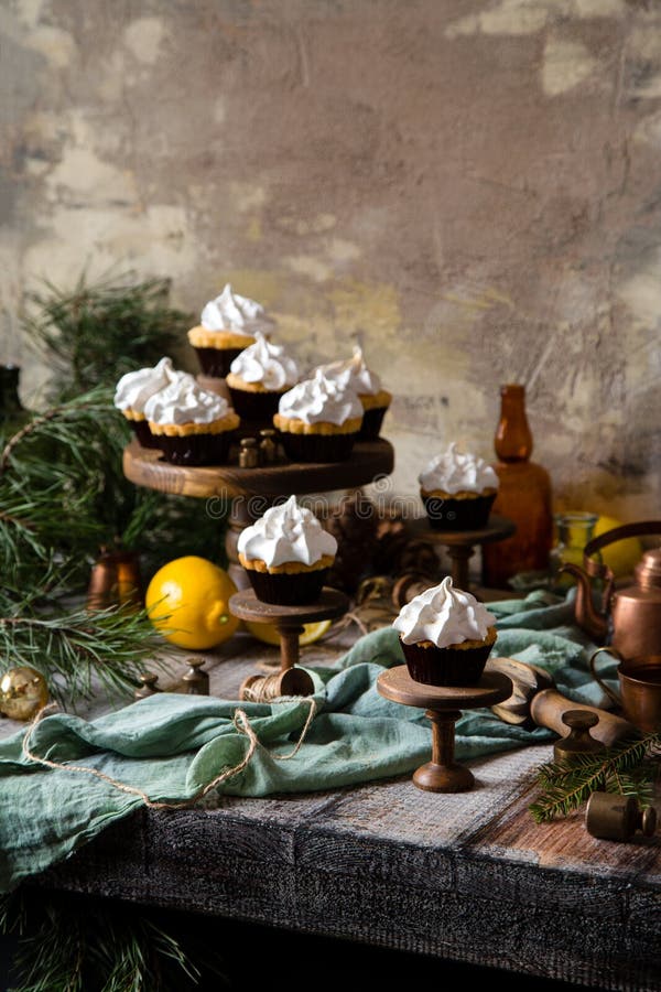 Lemon cupcakes with whipped meringue on wooden cake stands royalty free stock photos Lemon cupcakes with whipped meringue on wooden cake stands royalty free stock photos