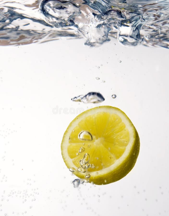 Lemon dropped into water