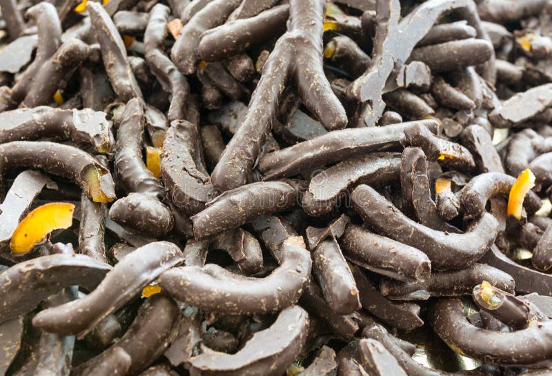 Lemon peels coated with dark chocolate. Typical Sicilian Pastry, Italy.