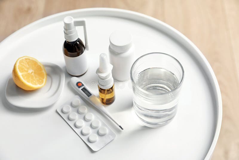 Pills and drugs for cold on table