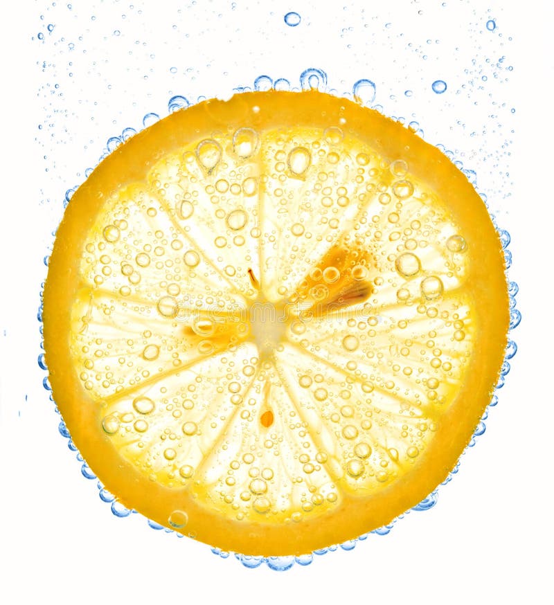 Lemon slice in clear water stock photos Lemon slice in clear water stock photos