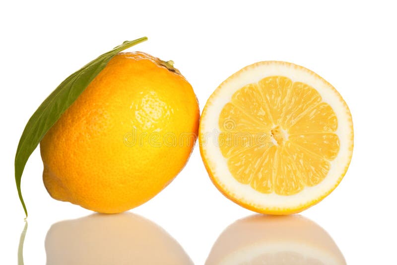 Lemon and slice of lemon on white