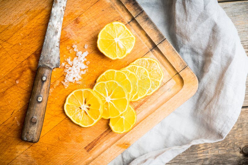 Lemon Slices on the Wooden Cutting Board Stock Photo - Image of rustic ...