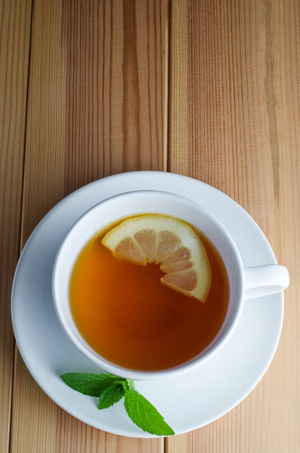 Lemon Tea with Mint Leaves stock photo. Image of wood 25320404