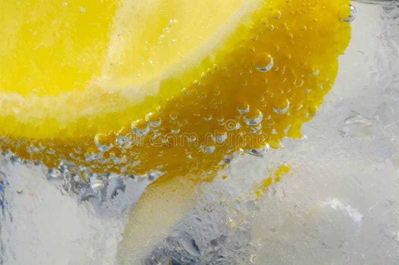 Lemon Wedge in Glass Mineral Water with Ice