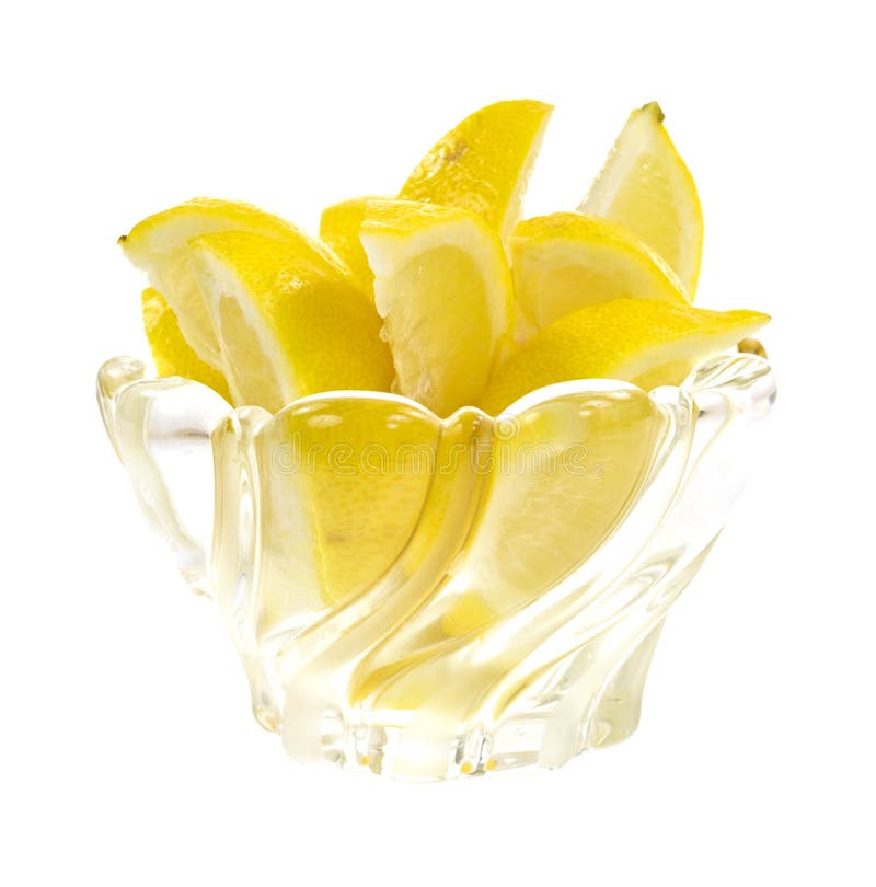 Lemon wedges in dish stock images