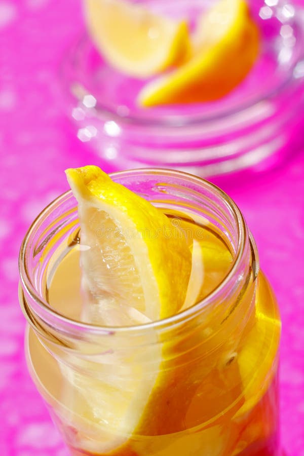 Lemon wedges in jar stock images