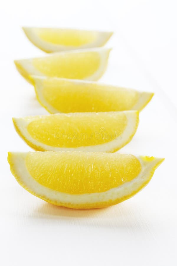 Lemon Wedges on White Background stock image