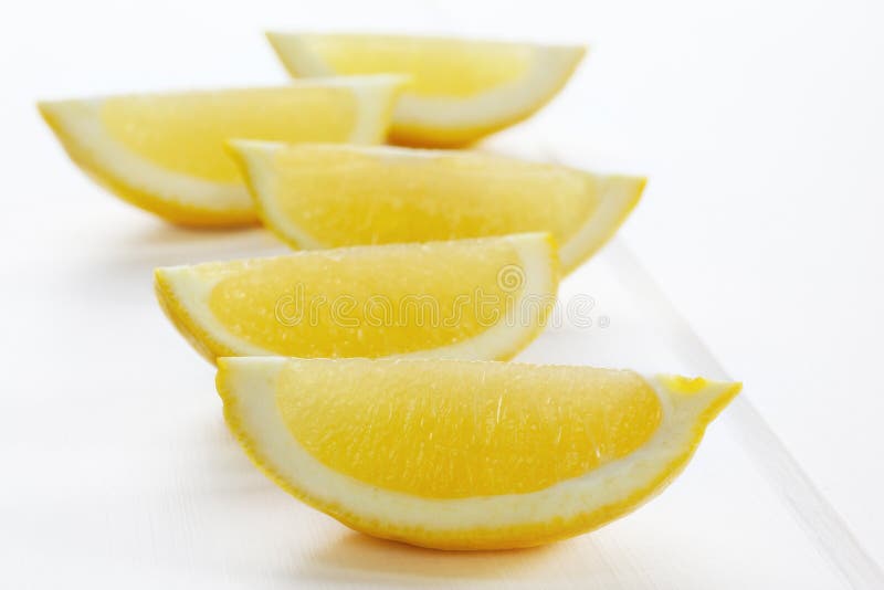 Lemon Wedges on White Background stock photography