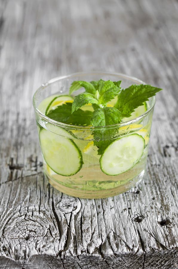 Lemonade with Cucumber, Lemon, Mint and Ginger in Glass Cups Stock