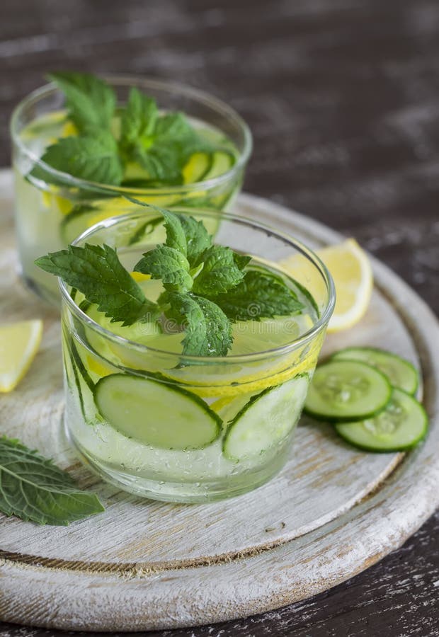 Lemonade with Cucumber, Lemon, Mint and Ginger in Glass Cups Stock