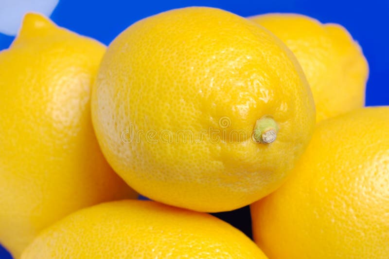 Lemons in a blue bowl.