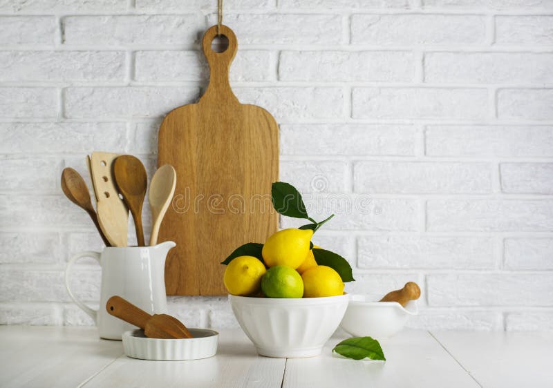 Lemons and limes in a bowl stock photo. Image of dinnerware 109975706
