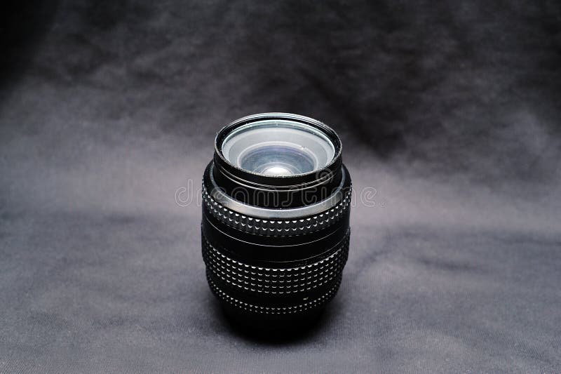 A lens for nikon on a black background