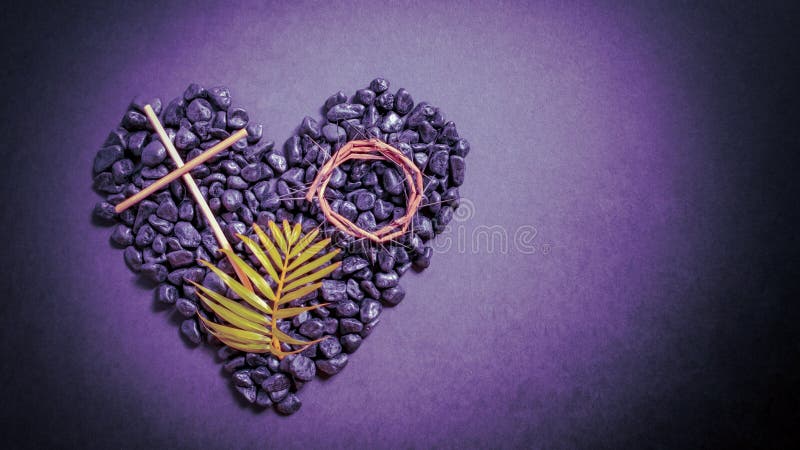 Lent Season,Holy Week and Good Friday concepts - image of wooden cross, crown of thorns and palm leave on stones in purple vintage