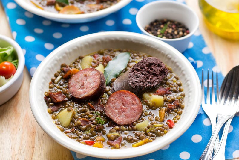 Lentil stew with carrots, potato, bell pepper and sausages stock image Lentil stew with carrots, potato, bell pepper and sausages stock image