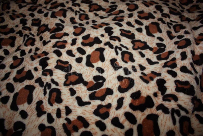 Leopardmuster auf Gewebedecke. Leopardmuster auf dekorativem Hintergrund der Gewebedecke
