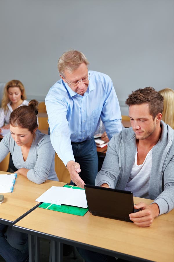 Teacher and college student in a class. Teacher and college student in a class