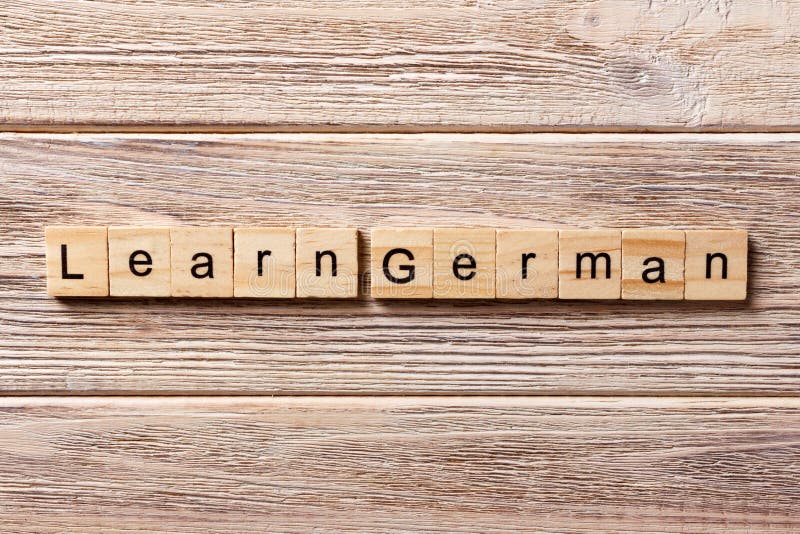 Lernen Sie das deutsche Wort, das auf hölzernen Block geschrieben wird Lernen Sie deutschen Text auf Tabelle, Konzept lizenzfreie stockfotos Lernen Sie das deutsche Wort, das auf hölzernen Block geschrieben wird Lernen Sie deutschen Text auf Tabelle, Konzept lizenzfreie stockfotos
