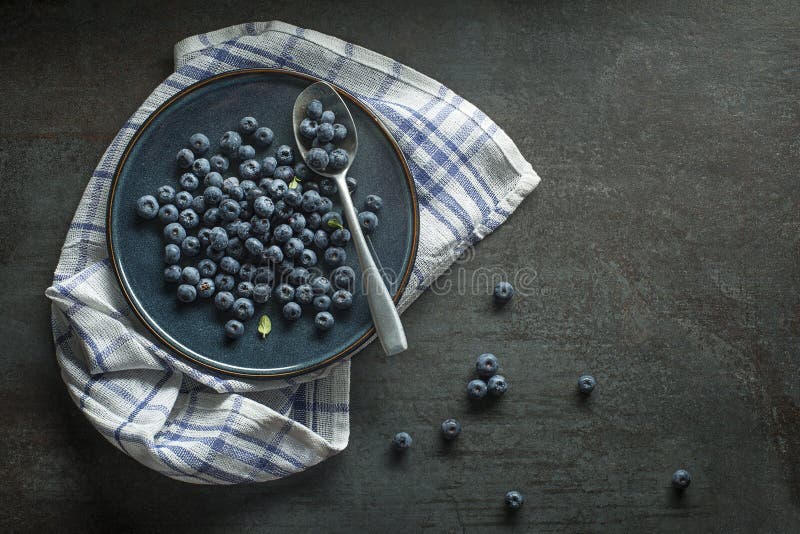 Eating Blueberry. Fresh raw berrie. Agriculture, Gardening, Harvest Concept. Eating Blueberry. Fresh raw berrie. Agriculture, Gardening, Harvest Concept