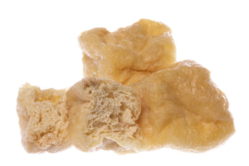 Isolated image of fried spongy beancurd cubes. Isolated image of fried spongy beancurd cubes.