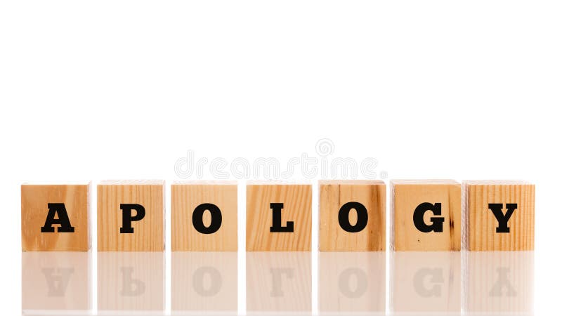 The word Apology on seven wooden cubes on a reflective white surface with copyspace above. The word Apology on seven wooden cubes on a reflective white surface with copyspace above.