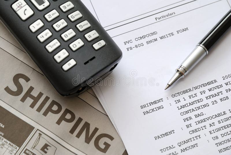 Shipping invoices and newspaper with pen on related documents. For business and office life, shipping and marine industry, and sales and purchase concepts. Shipping invoices and newspaper with pen on related documents. For business and office life, shipping and marine industry, and sales and purchase concepts.