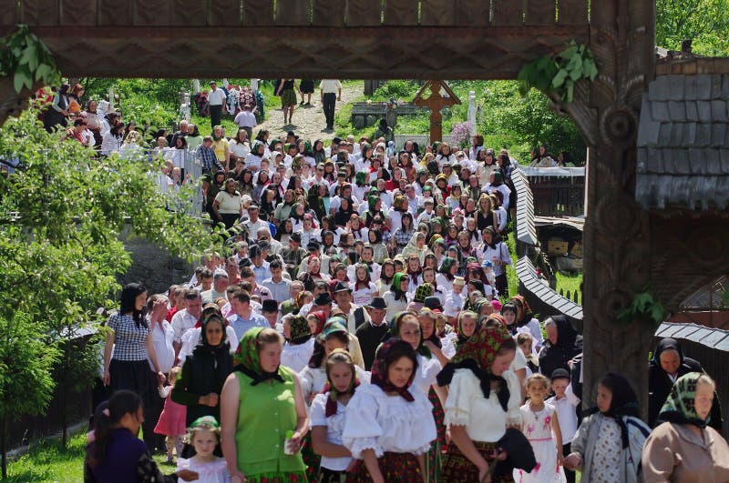 People in traditional national costume returning from church, on Sunday service - landmark attraction in Maramures, Romania. People in traditional national costume returning from church, on Sunday service - landmark attraction in Maramures, Romania.