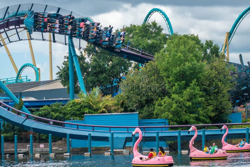 Orlando, Florida. June 17, 2019.  People enjoying Mako rollercoaster and swan  boats at Seaworld 1. Orlando, Florida. June 17, 2019.  People enjoying Mako rollercoaster and swan  boats at Seaworld 1