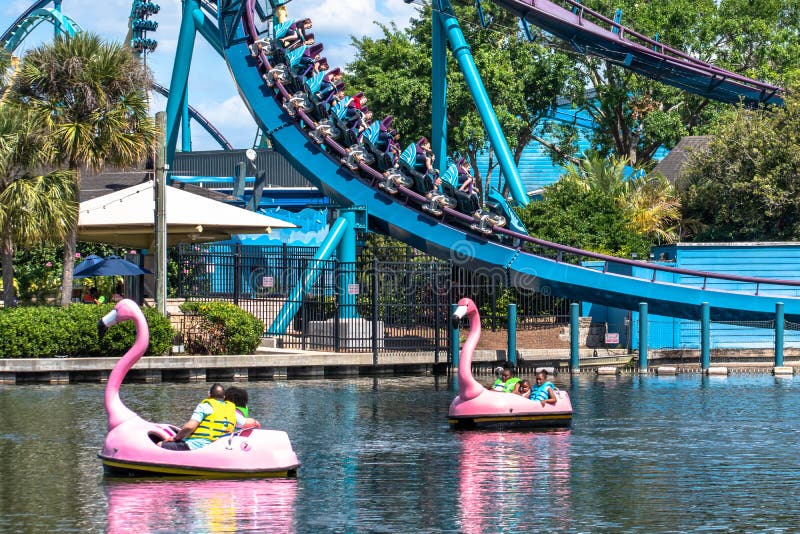 Orlando, Florida. March 14, 2020. People enjoying Mako rollercoaster and paddle swan boats at Seaworld 1. Orlando, Florida. March 14, 2020. People enjoying Mako rollercoaster and paddle swan boats at Seaworld 1
