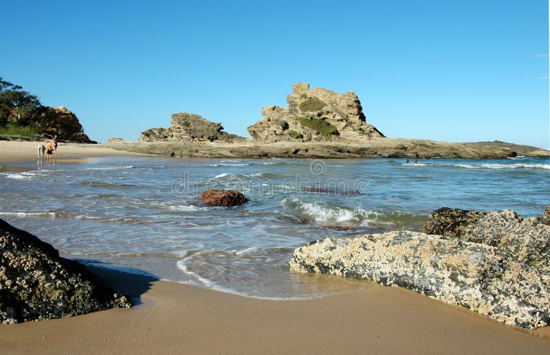 Les gens sur une plage photographie stock Les gens sur une plage photographie stock