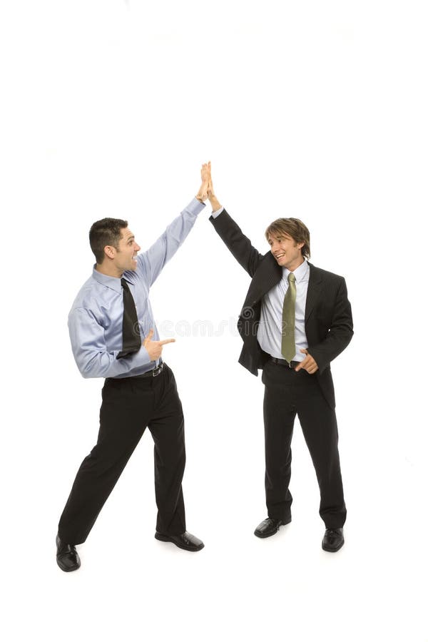 Two businessmen give each other a high five. Two businessmen give each other a high five