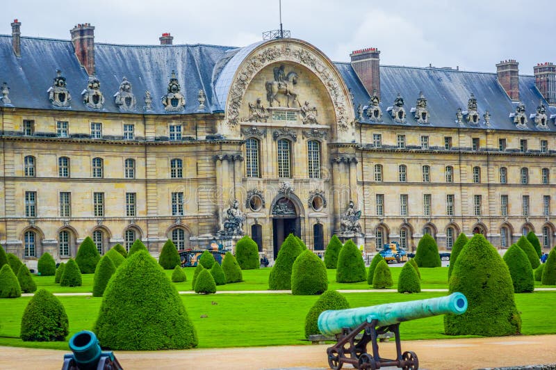 PARIS, FRANCE - JUNE 1, 2015: Les Invalids, The National Redisdence of the Invalids, complex of buildings in Paris relating to the military history of France. PARIS, FRANCE - JUNE 1, 2015: Les Invalids, The National Redisdence of the Invalids, complex of buildings in Paris relating to the military history of France