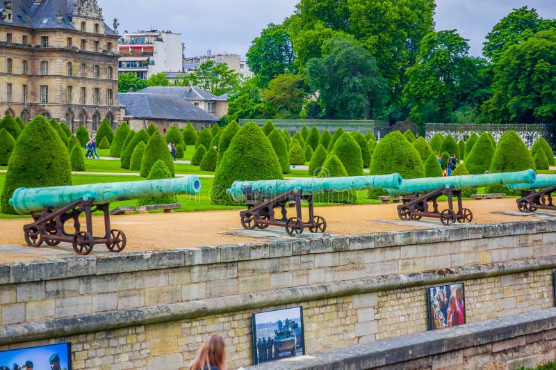 PARIS, FRANCE - JUNE 1, 2015: Garden in Les Invalids, The National Redisdence of the Invalids, complex of buildings in Paris relating to the military history of France. PARIS, FRANCE - JUNE 1, 2015: Garden in Les Invalids, The National Redisdence of the Invalids, complex of buildings in Paris relating to the military history of France