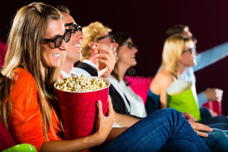 Young people watching 3d movie at movie theater. Young people watching 3d movie at movie theater