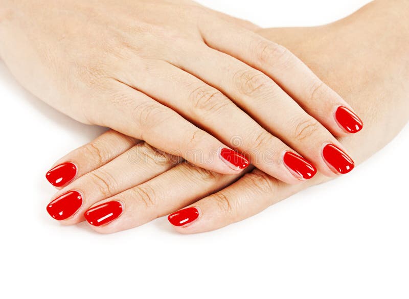 Manicure - Beautiful manicured woman's hands with red nail polish. Manicure - Beautiful manicured woman's hands with red nail polish