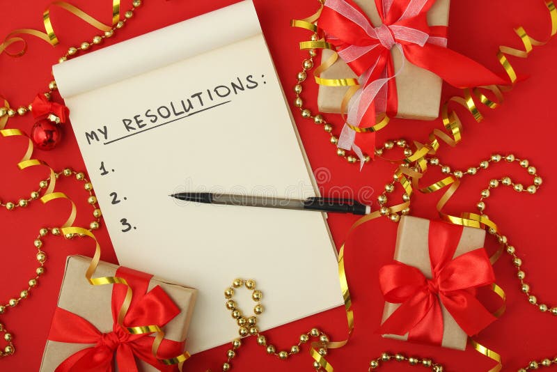 Les résolutions de nouvelle année prévoient dans un carnet images stock Les résolutions de nouvelle année prévoient dans un carnet images stock