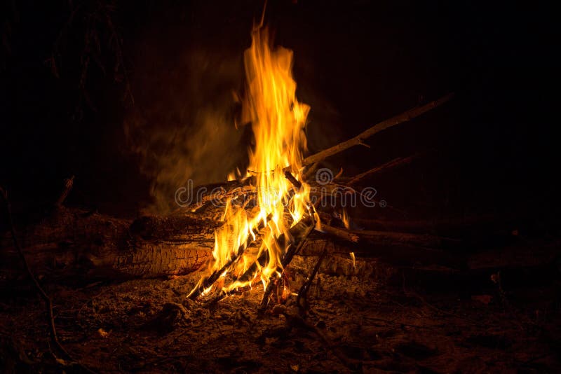 The fire of the bonfire dances in the silence of the night. The fire of the bonfire dances in the silence of the night