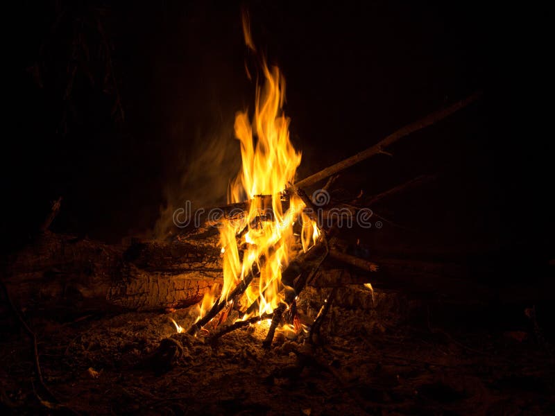 The fire of the bonfire dances in the silence of the night. The fire of the bonfire dances in the silence of the night