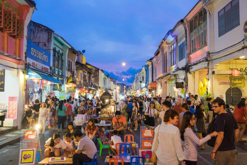 Unidentified tourists are shopping at old town night market is called Lard Yai in Phuket, Thailand. Unidentified tourists are shopping at old town night market is called Lard Yai in Phuket, Thailand.