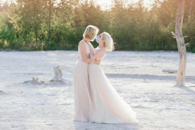 Lesbian Couple Wedding, Wear Masks To Prevent Epidemic COVID-19 Stock Photo  picture