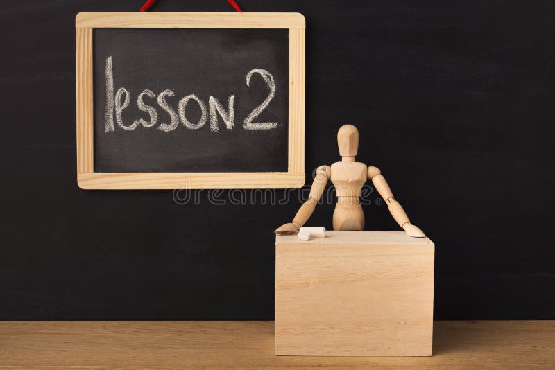 Lesson 2 written with chalk on blackboard. royalty free stock photography Lesson 2 written with chalk on blackboard. royalty free stock photography