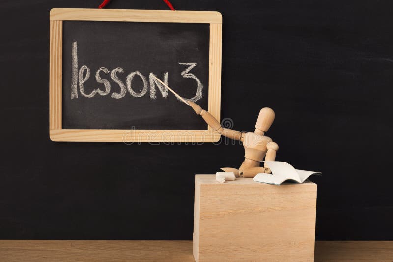 Lesson 3 written with chalk on blackboard. stock photography Lesson 3 written with chalk on blackboard. stock photography