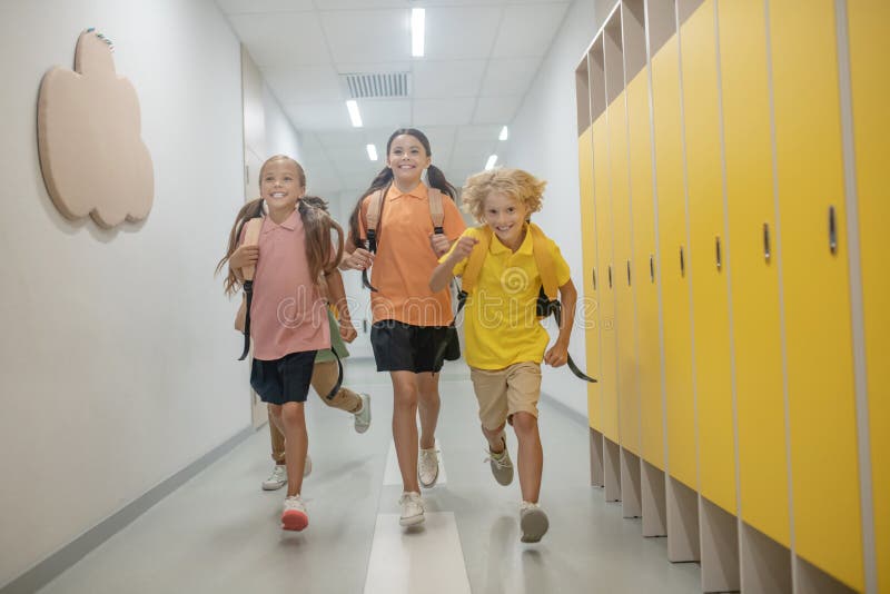 Schoolchildren Running in the School Corridor after Lessons Stock Image