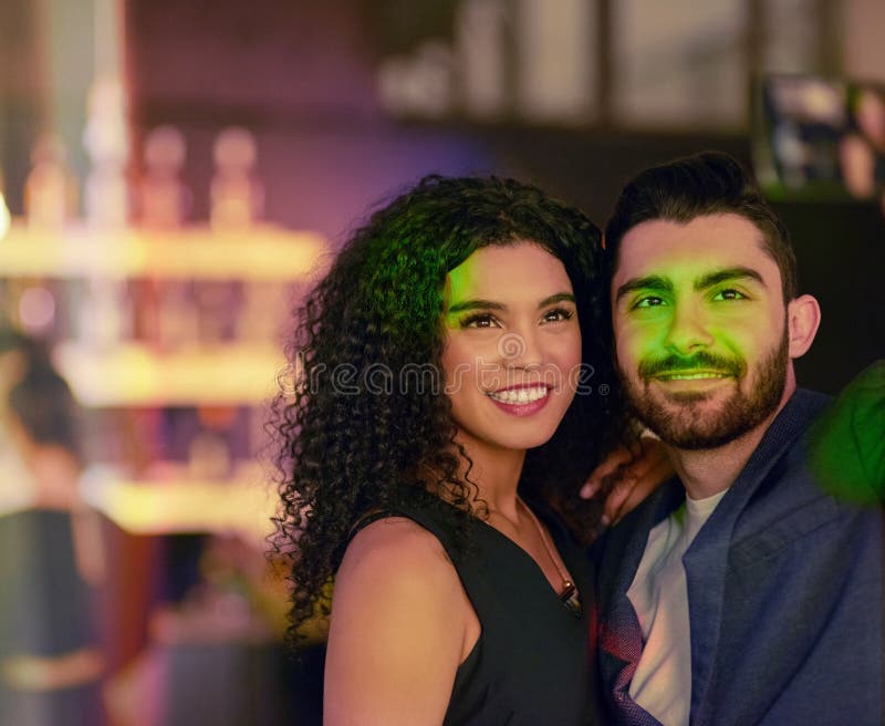 Let the good times roll. a young couple enjoying themselves at a nightclub.