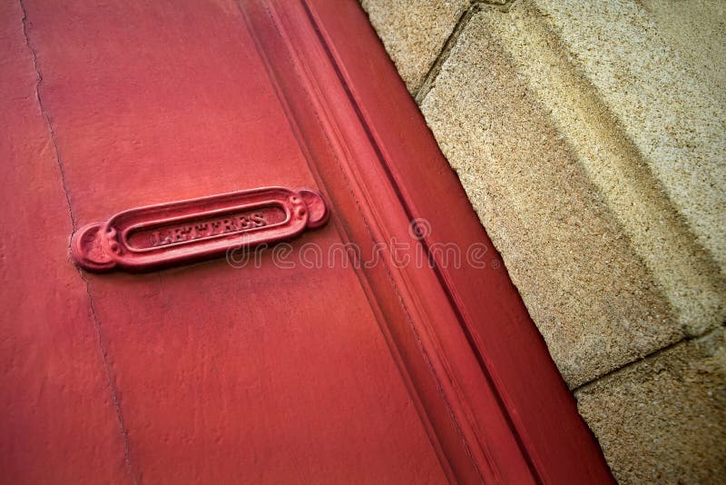 Old French letter box of a red door