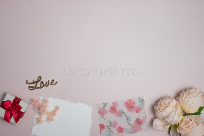 Letter concept with a white letter, flowers, envelope on a pink background stock images