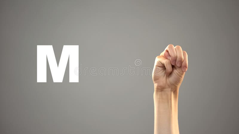 Letter M in sign language, hand on background, communication for deaf, lesson stock photo Letter M in sign language, hand on background, communication for deaf, lesson stock photo